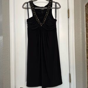 Black Sleeveless low cut Dress with Embellished Neckline and padded bust area.